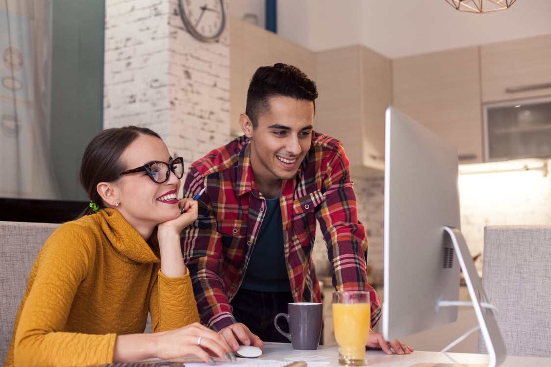 Happy Couple working on computer together