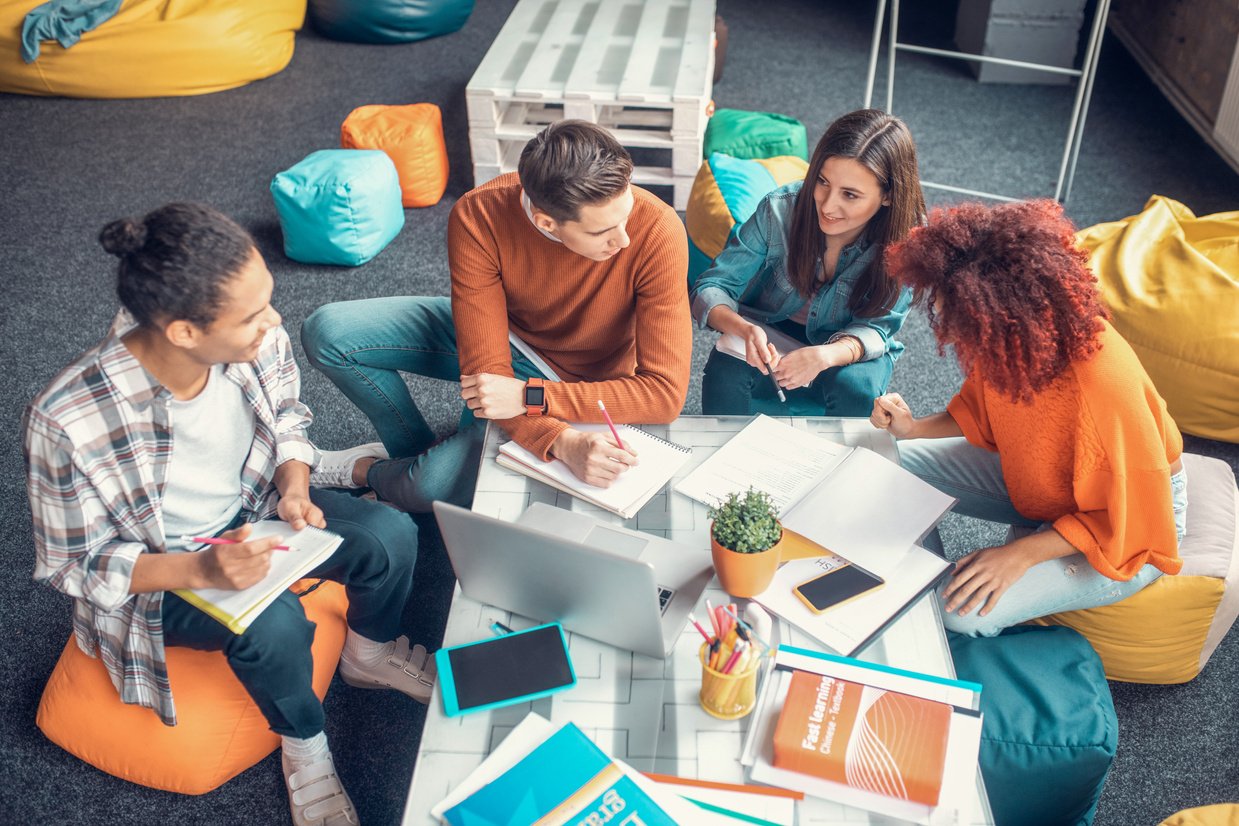 Students having group discussion while preparing for group project